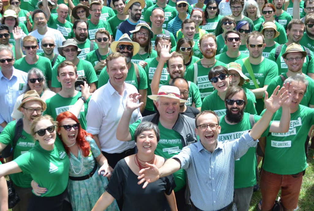 Melbourne federal Greens MP Adam Bandt (front) door knocking  around Sydney's Camperdown with a team of NSW Greens supporters, Leichhardt state Greens MP Jamie Parker (white shirt) and Greens candidate for Newtown Jenny Leong (in black). PHOTO: Benedict Brook; Star Observer