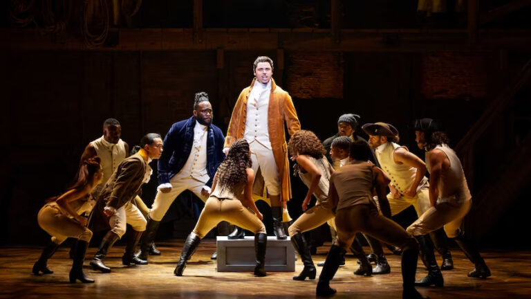 Jason Arrow centre as Alexander Hamilton in the Australian production. Credit Michael Cassel GroupDaniel Boud 768x432